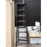 A VINTAGE WOODEN EIGHT RUNG STEP LADDER