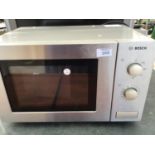 A BOSCH STAINLESS STEEL MICROWAVE IN WORKING ORDER