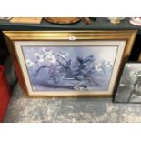 A LARGE GILT FRAMED FLORAL PRINT