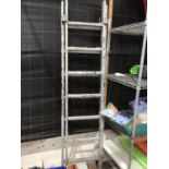 A FOURTEEN RUNG TWO SECTION ALUMINIUM STEP LADDER