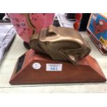 AN ABSTRACT METAL MODEL ON WOODEN BASE WITH PRESENTATION PLAQUE