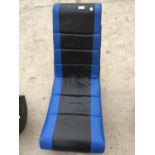 A BLACK AND BLUE ROCKING GAMING CHAIR (SMALL SLIT IN SEAT)