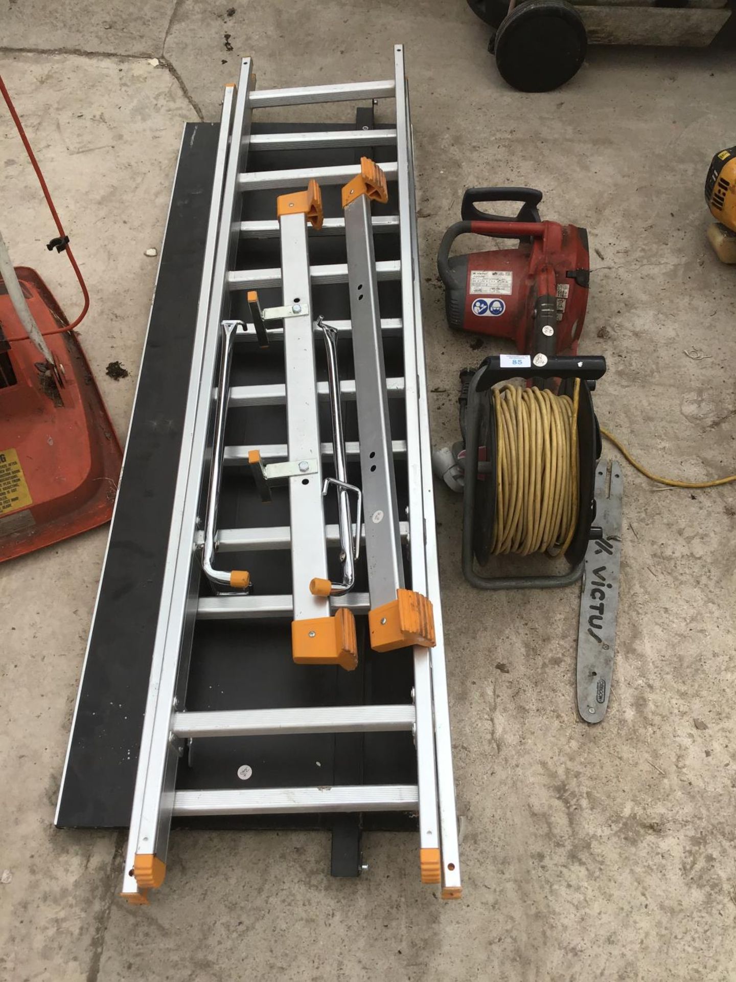 A WORKZONE SCAFFOLD AND LADDER SYSTEM WITH AN EXTENSION CABLE AND A VICTU CHAIN SAW FOR SPARE OR