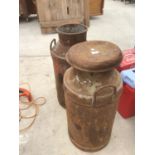 A PAIR OF VINTAGE MILK CHURNS (ONE WITH CORROSION TO THE BASE)