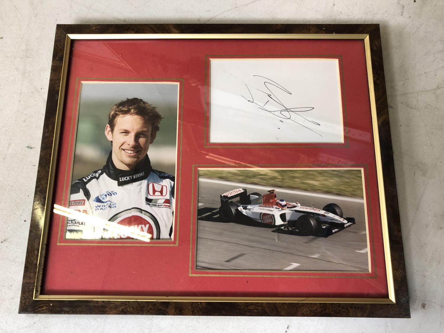 A FRAMED JENSEN BUTTON F1 RACING PICTURE, SIGNED WITH C.O.A