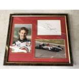 A FRAMED JENSEN BUTTON F1 RACING PICTURE, SIGNED WITH C.O.A