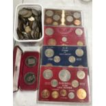 A MIXED GROUP OF COINS - JERSEY CASED COINS, FOUR DECIMAL SETS AND A TUB OF COINS