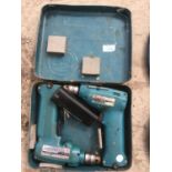 TWO MAKITA DRILLS IN A CASE WITH A SPARE BATTERY