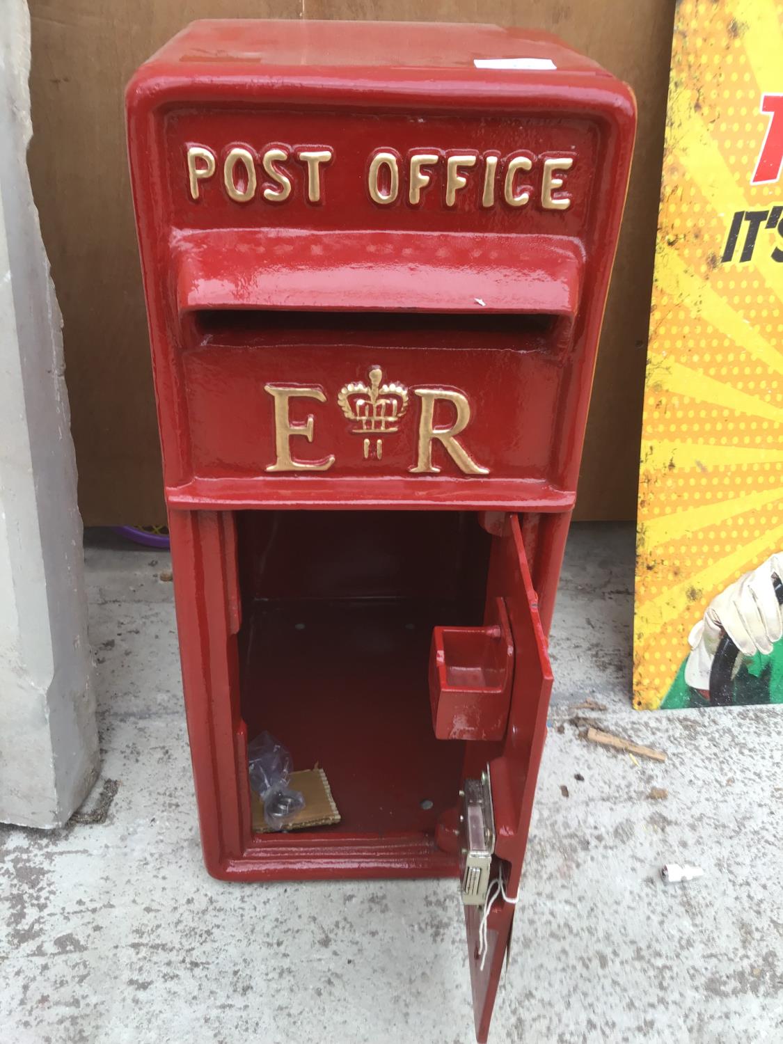 A RED POST OFFICE POST BOX WITH KEYS