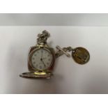 A WHITE METAL POCKET WATCH AND CHAIN