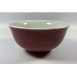 A POSSIBLY 19TH CENTURY CHINESE SANG DE BOEUF FLAMBE TEA BOWL, SIX CHARACTER MARK TO BASE, HEIGHT