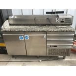 A STAINLESS STEEL CHILLER UNIT WITH DOUBLE DOORS AND THREE DRAWERS WITH SERVING TOP