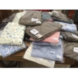 A LARGE COLLECTION OF NEW AND BAGGED LADIES CLOTHING TO INCLUDE PYJAMAS, SHIRTS, TROUSERS ETC