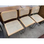 THREE RETRO RATTAN BACK AND SEAT DINING CHAIRS