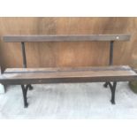 A WOODEN BENCH WITH CAST IRON BENCH ENDS DETAILED WITH 'UNITY WOOD & IRON CO PADIHAM' 157CM LONG