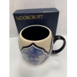 A BOXED MOORCROFT MUG STAMPED