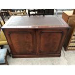 A LEATHER TOP MAHOGANY CABINET