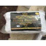 TWO PACKS OF HOTEL PILLOWS (TWO PILLOW PER PACK)
