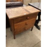 AN OAK CHEST OF THREE DRAWERS