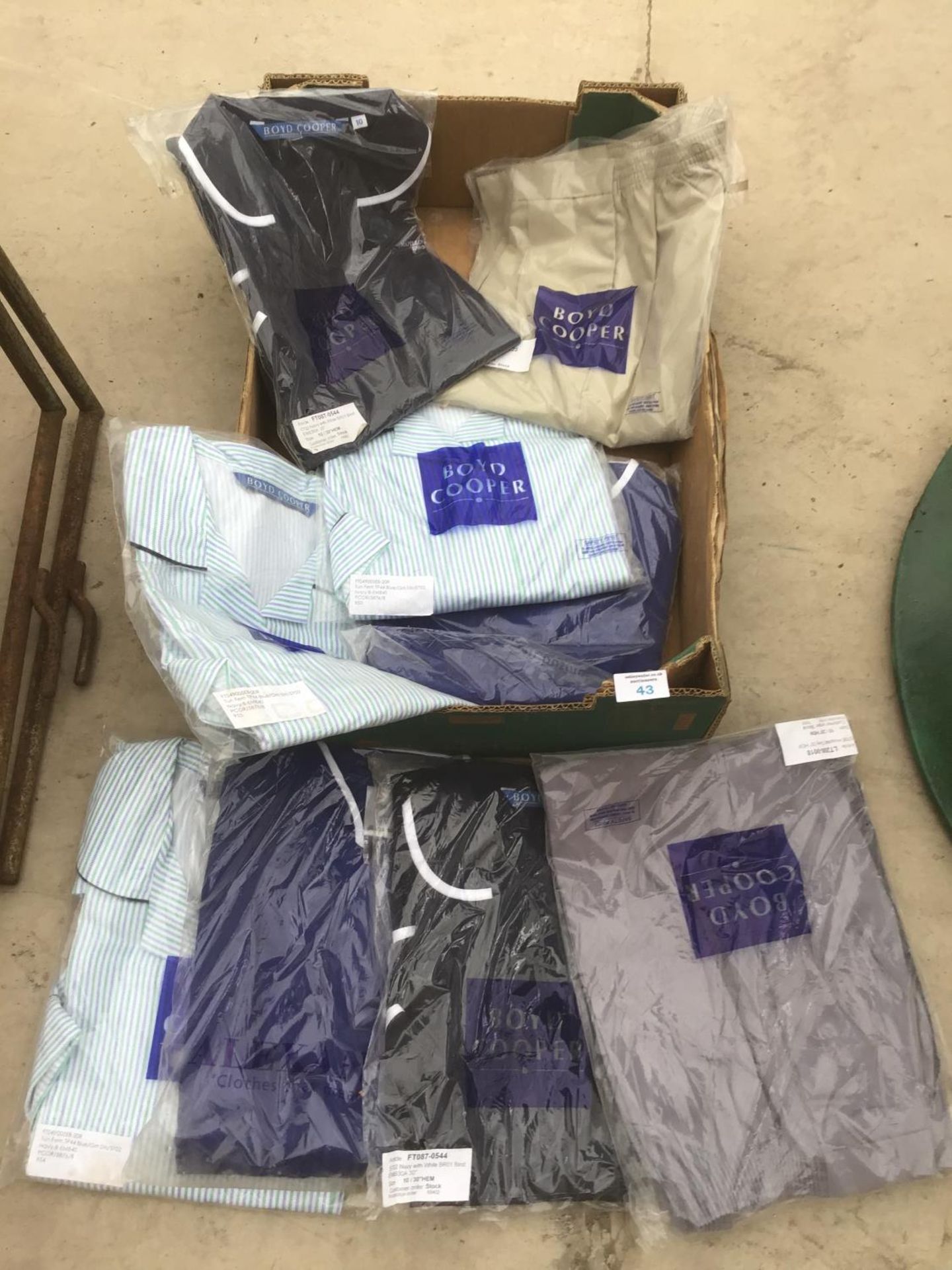 NINE VARIOUS NEW UNIFORM TOPS AND SHORTS