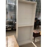 A MODERN WHITE BOOKCASE