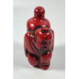 AN ORIENTAL CORAL TYPE RED FIGURAL SNUFF BOTTLE