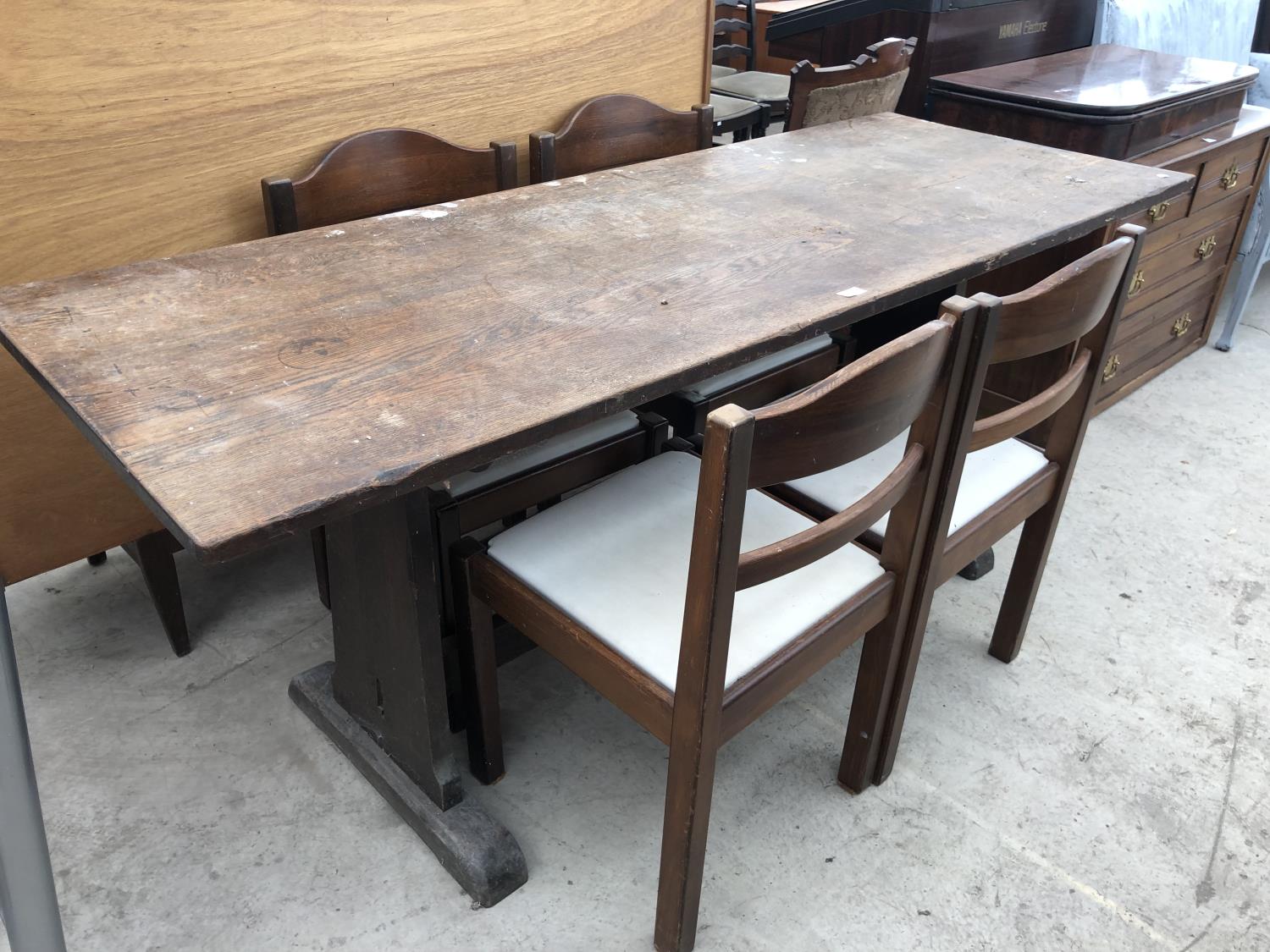 AN OAK DINING TABLE AND FOUR DINING CHAIRS