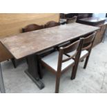 AN OAK DINING TABLE AND FOUR DINING CHAIRS