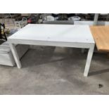 A WHITE DINING TABLE