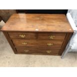 AN OAK CHEST OF TWO SHORT OVER TWO LONG DRAWERS