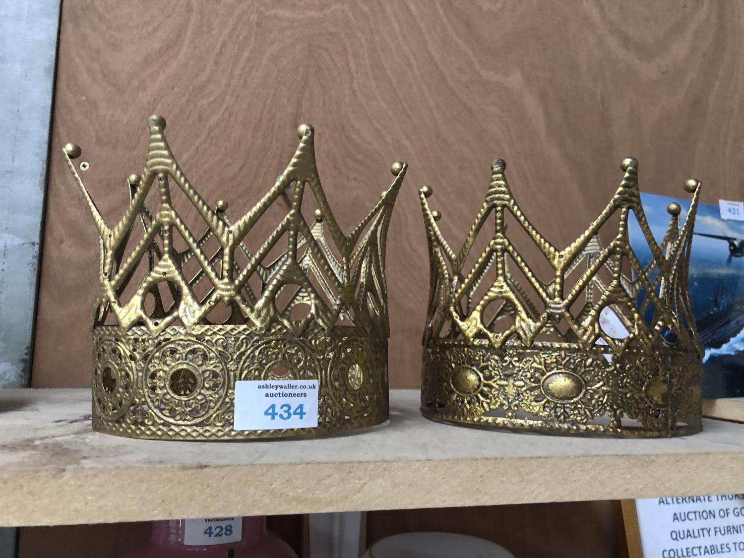 A PAIR OF DECORATIVE GOLD COLOURED CROWNS