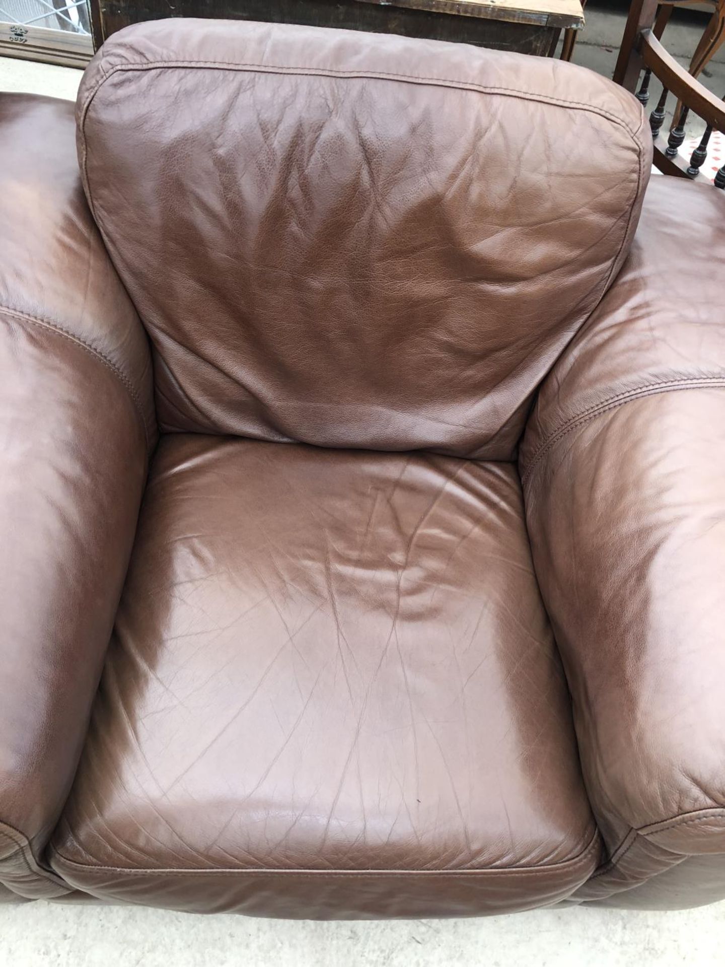 A BROWN LEATHER ARMCHAIR AND FOOTSTOOL - Image 2 of 2