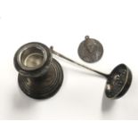 A HALLMARKED SILVER DWARF CANDLESTICK, SIFTER AND MEDAL (3)