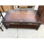 A MAHOGANY COFFEE TABLE WITH TWO DRAWERS WITH RECESSED BRASS HANDLES