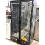 A DOUBLE FRONTED GLASS DOOR DISPLAY FRIDGE