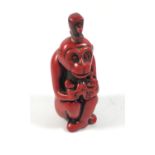 AN ORIENTAL CORAL TYPE RED MONKEY SNUFF BOTTLE