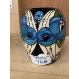 A SMALL MOORCROFT RED ROSE BLUE VASE