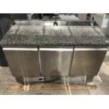 A THREE DOOR STAINLESS STEEL CHILLER UNIT WITH SERVING TOP IN WORKING ORDER (DAMAGE TO BASE - SEE