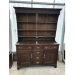 A 19TH CENTURY OAK DRESSER WITH UPPER PLATE RACK AND LOWER DRAWERS AND DOORS