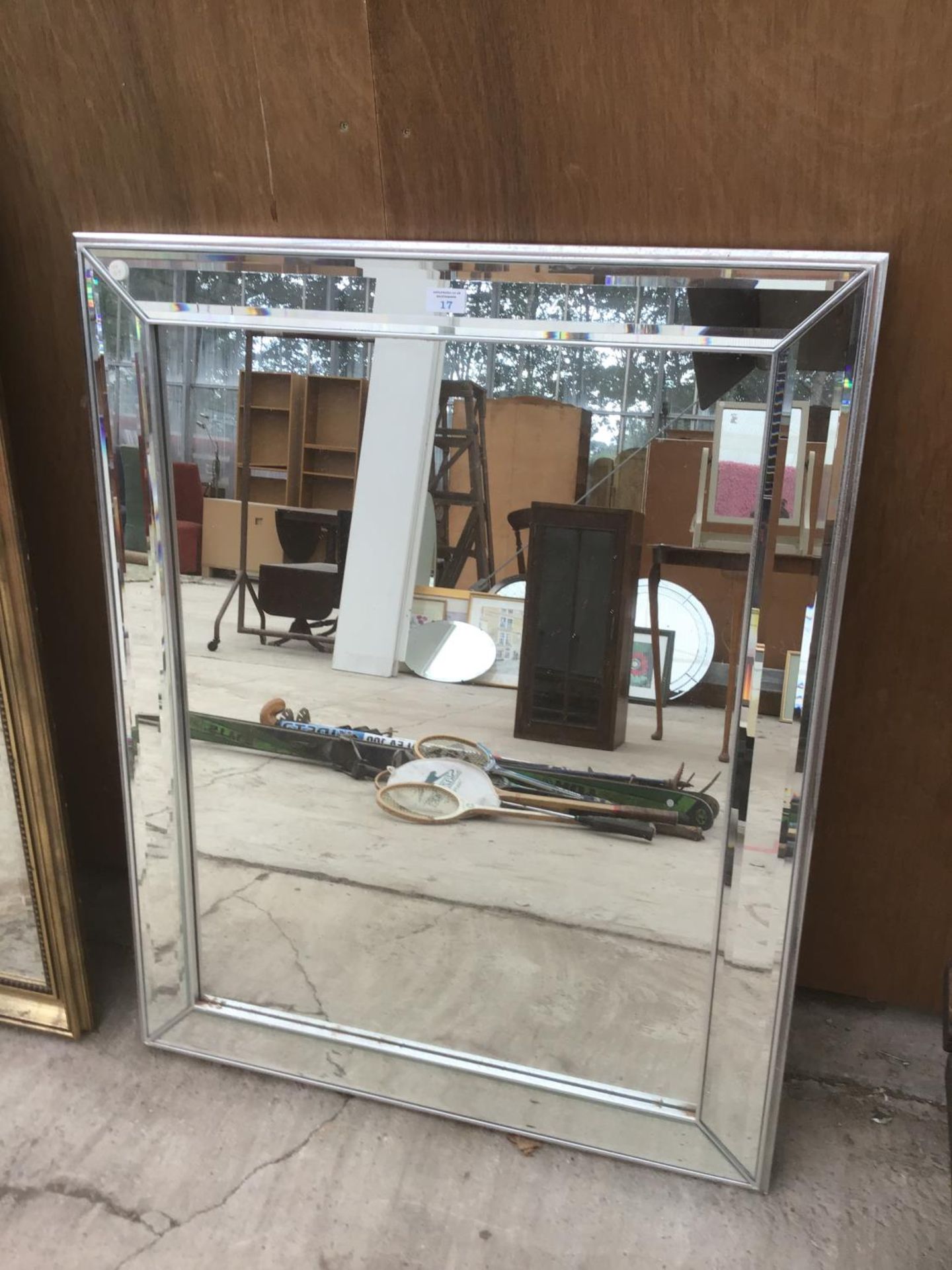 A LARGE MIRROR WITH MIRRORED FRAME