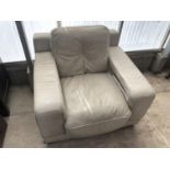 A GREY LEATHER STYLE ARMCHAIR