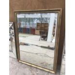 A LARGE MIRROR WITH GILT EFFECT FRAME