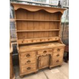 A LARGE VINTAGE PINE COUNTRY HOUSE DRESSER UNIT WITH UPPER PLATE RACK AND LOWER DRAWERS AND SINGLE