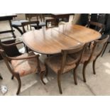 A MAHOGANY EXTENDING DINING TABLE AND SIX DINING CHAIRS TO INCLUDE TWO CARVERS