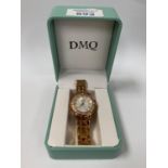 A BOXED D.M.Q WRIST WATCH