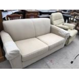 A CREAM UPHOLSTERED TWO SEATER SOFA AND LEATHER ARMCHAIR (2)