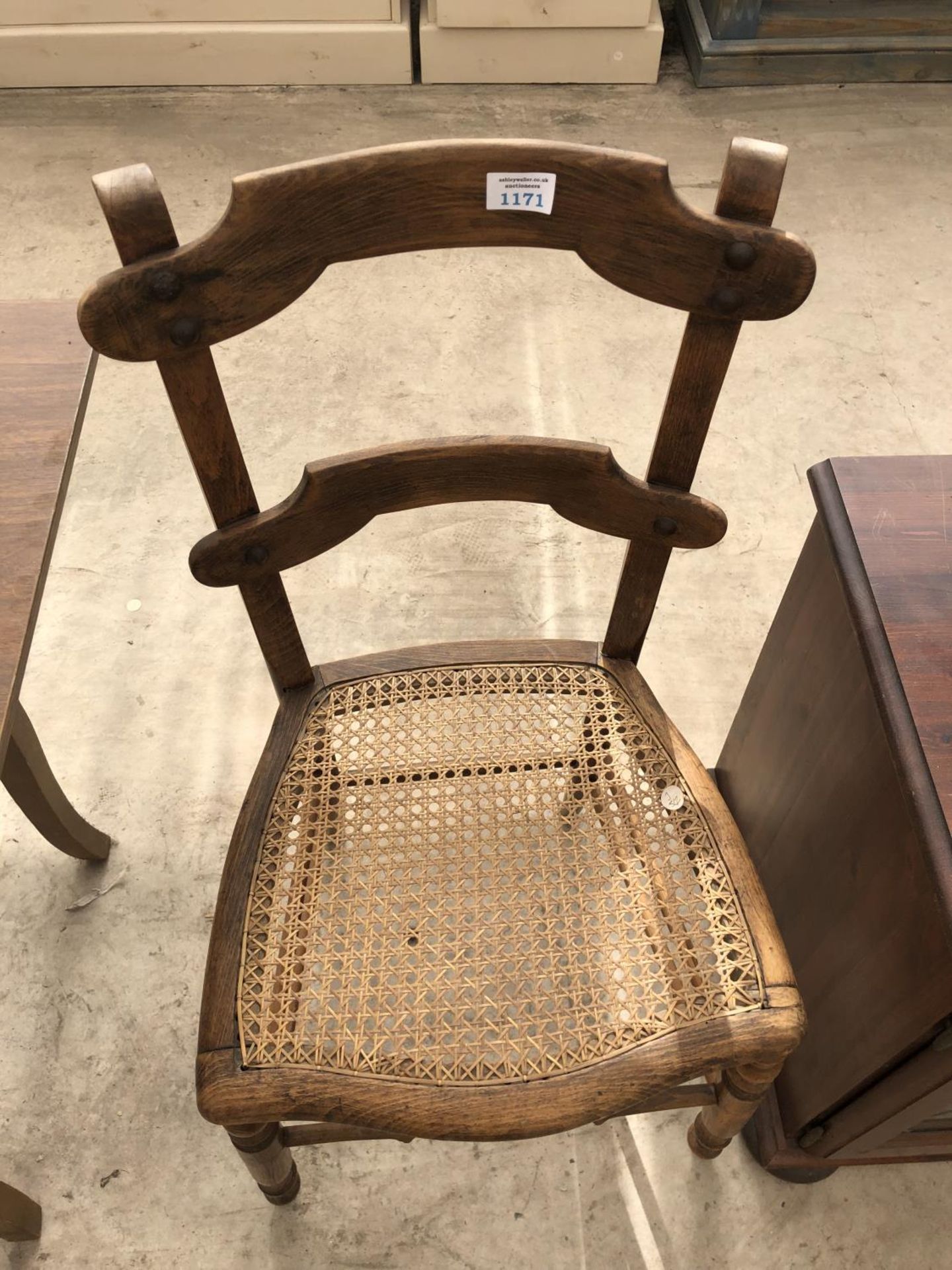 A MAHOGANY DINING CHAIR WITH RATTAN SEAT