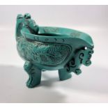 AN UNUSUAL ORIENTAL TURQUOISE DRINKING CUP, HEIGHT 8.5CM