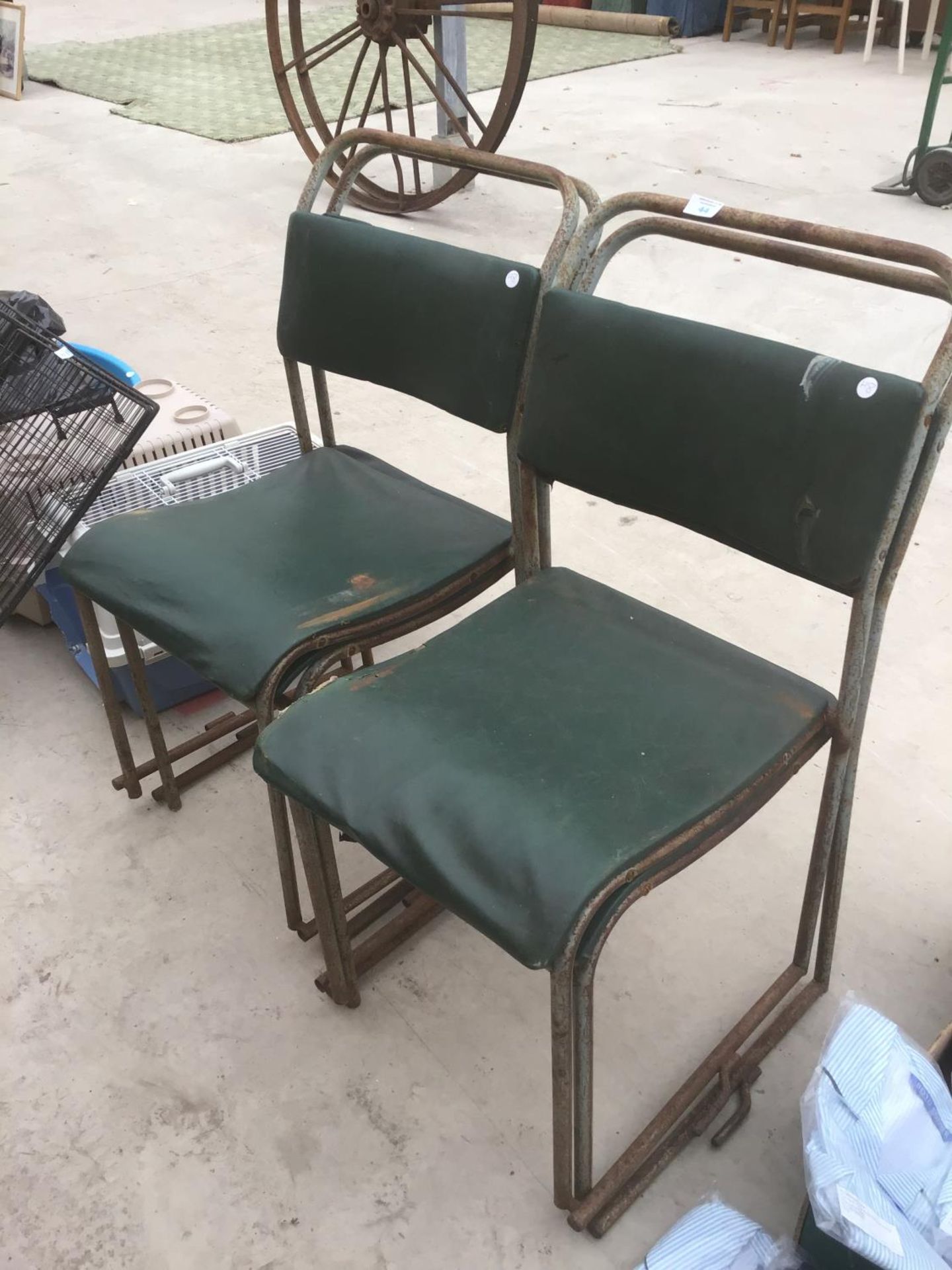 FOUR VINTAGE STACKING CHAIRS