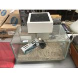 A FISH TANK/AQAURIUM WITH ACCESSORIES TO INCLUDE A MINI HEATER IN WORKING ORDER